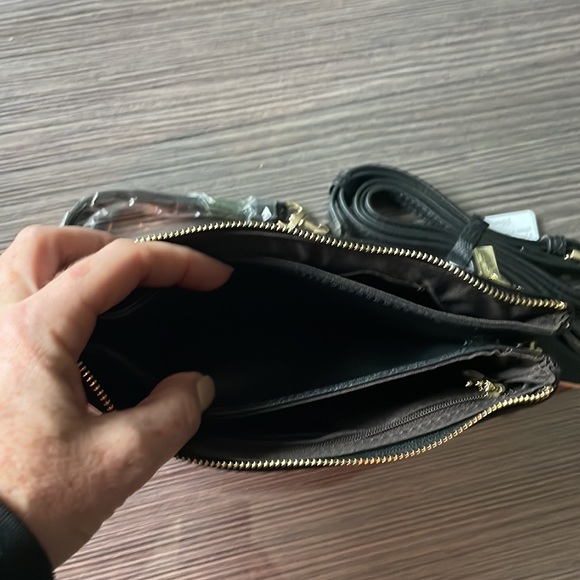 Small black leather crossbody with optional wristlet strap. - Picture 4 of 10